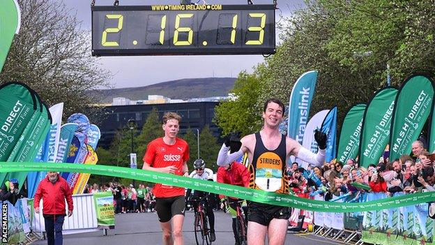 Paul Pollock crosses the line to win the Belfast City Marathon