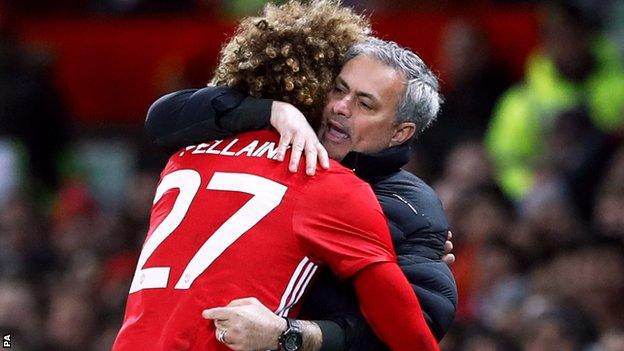 Marouane Fellaini hugs Jose Mourinho