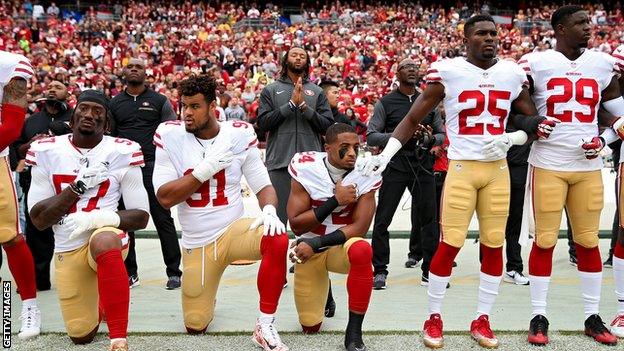 San Francisco 49ers kneeling