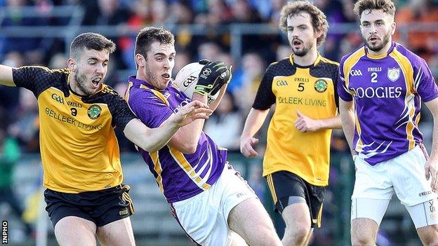 Ryan Lyons of Erne Gaels challenges Derrygonnelly's Ryan Jones in Sunday's final