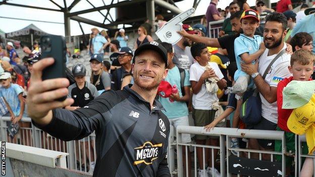 Jos Buttler takes a selfie with a young fan before Manchester Originals game against Welsh Fire