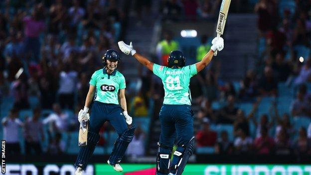 Dane van Niekerk and Mady Villiers of Oval Invincibles celebrate the winning runs during The Hundred match between Oval Invincibles and Manchester Originals at The Kia Oval