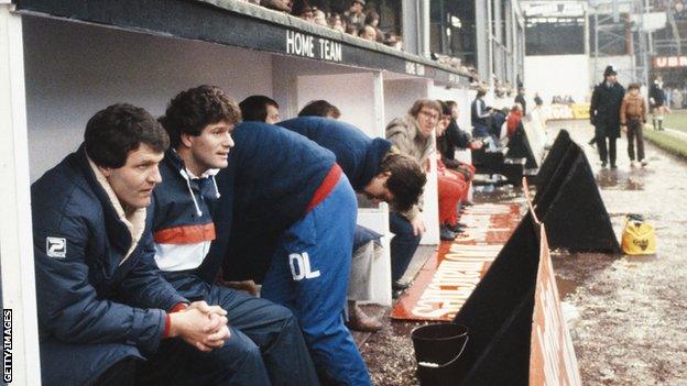 John Toshack in the dug-out at the Vetch Field as Swansea manager in a match against Liverpool