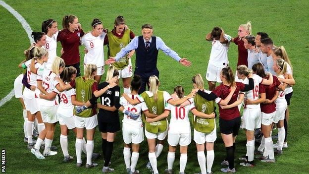 England boss Phil Neville in a huddle with his players during the Women's World Cup