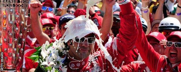 Dario Franchitti celebrates after winning in 2012