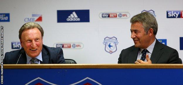 Cardiff boss Neil Warnock says he will sit down with chairman Mehmet Dalman (R) in the new year