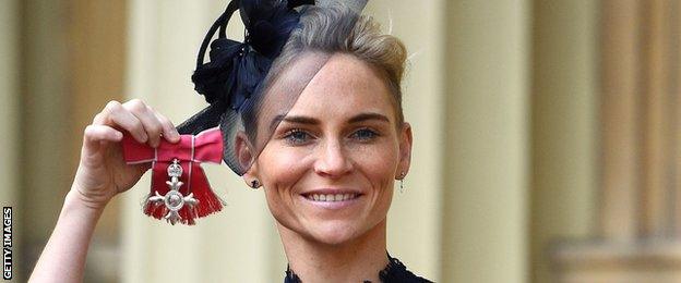 Jess Fishlock poses with her medal after being appointed a Member of the Order of the British Empire (MBE) for services to womens football and the LGBT community during an investiture ceremony at Buckingham Palace