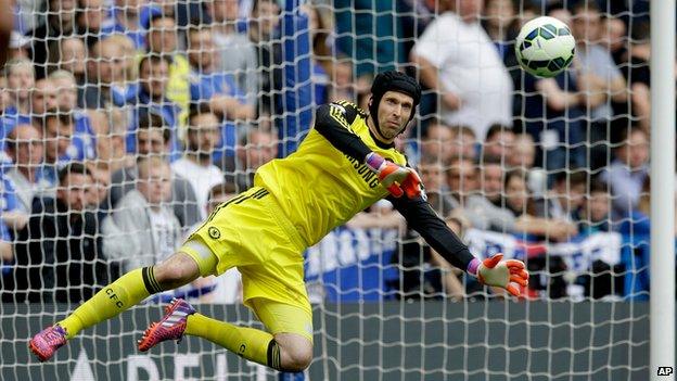 Petr Cech makes a save during the English Premier League soccer match between Chelsea and Sunderland at Stamford Bridge stadium in London.