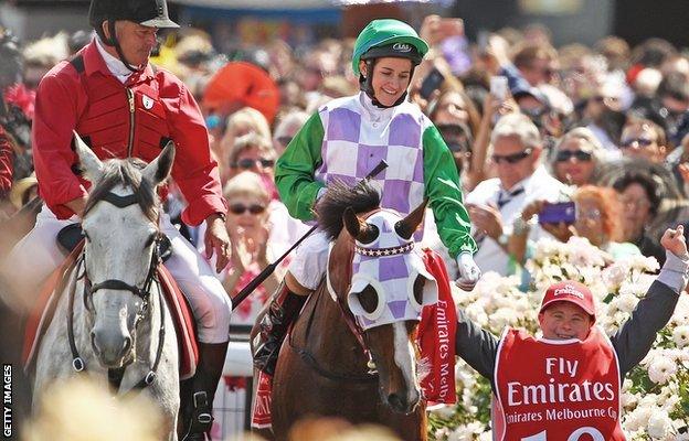 Michelle Payne and brother Stevie (right) celebrate the Melbourne Cup victory