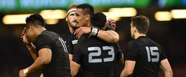 Malakai Fekitoa (centre) celebrates with teammates