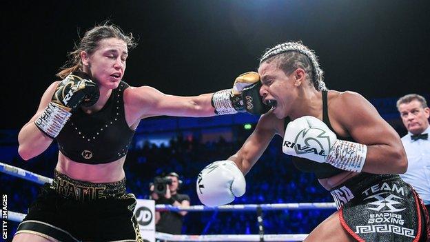 Irish boxer Katie Taylor (left) lands a punch on Christina Linardatou (right) in winning the WBO super-lightweight title