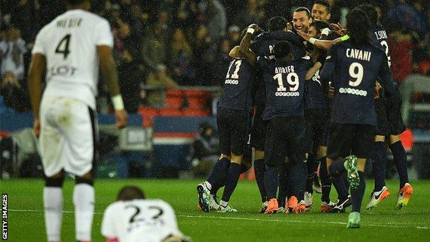 Paris St-Germain's players celebrate scoring against Rennes