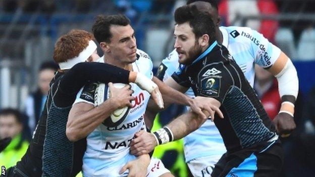 Racing wing Juan Imhoff is tackled by Glasgow's Rob Harley (left) and Tommy Seymour