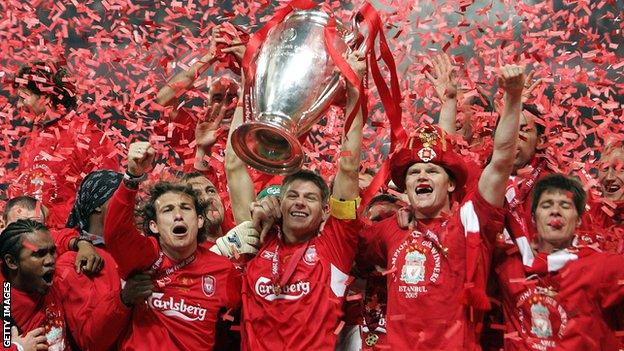 Liverpool players celebrate with the trophy after winning the 2004/05 Champions League final