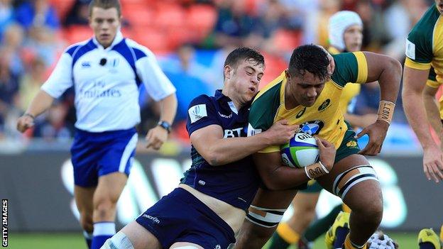 Callum Hunter-Hill of Scotland tackles Robert Leota of Australia