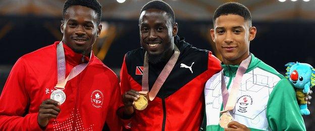 Aaron Brown and winner Hereem Richards join Leon Reid on the 200m podium at the Carrara Stadium