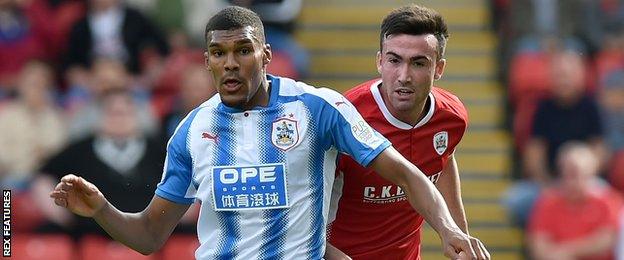 Huddersfield Town's Collin Quaner and Barnsley's Stevie Mallan