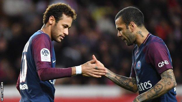 Neymar and Dani Alves celebrate a Paris St-Germain goal