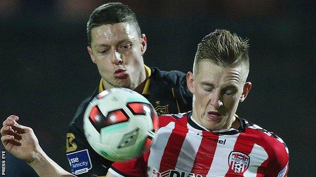 Derry striker Ronan Curtis battles with Dundalk's Shane Grimes in the FAI Cup semi-final replay