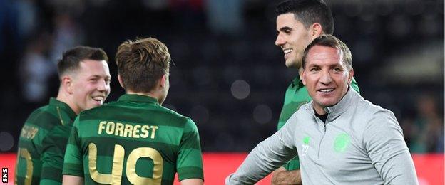 Celtic manager Brendan Rodgers congratulates his players in Trondheim