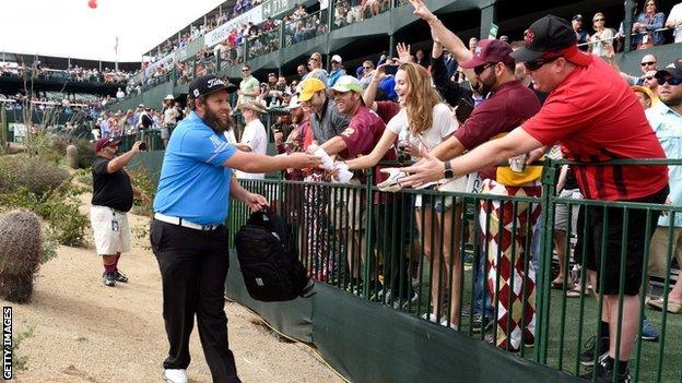 Andrew Johnston giving gifts to fans