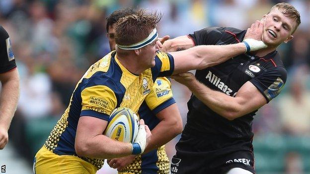 Gj Van Velze fends off Saracens & England wing Chris Ashton on the opening weekend of the season