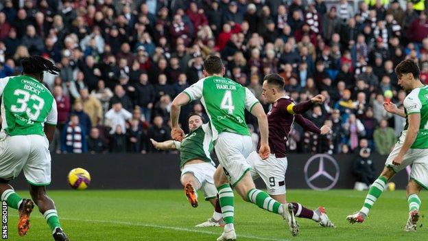 Hearts' Lawrence Shankland scores to make it 1-0 during a cinch Premiership match between Heart of Midlothian and Hibernian at Tynecastle