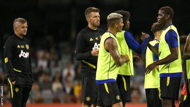 Ole Gunnar Solskjaer (left) watches players in training