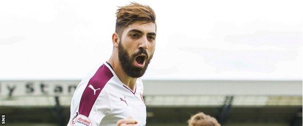 Juanma's two goals fired Hearts to the top of the table