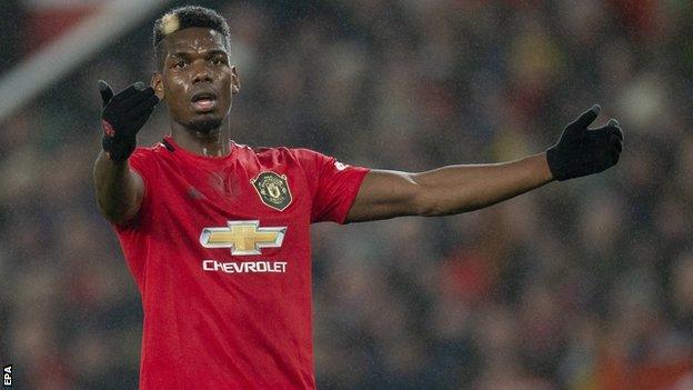 Paul Pogba playing for Manchester United