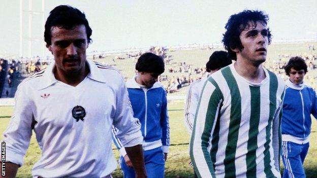 Michelle Platini leaves the field with a Hungary opponent at the 1978 World Cup