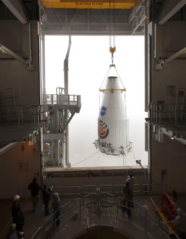 Nose cone raised to put on the top of the rocket