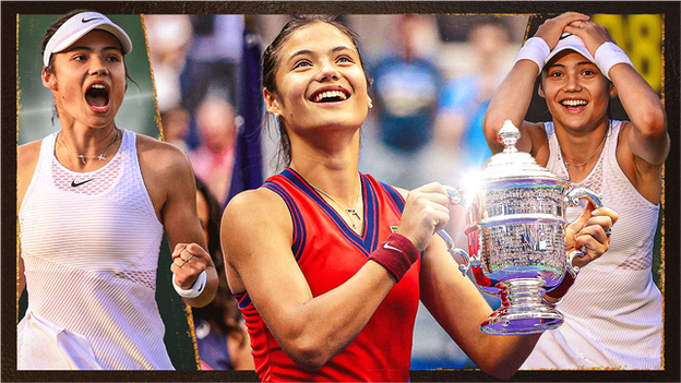 Emma Raducanu looks up while holding the US Open trophy