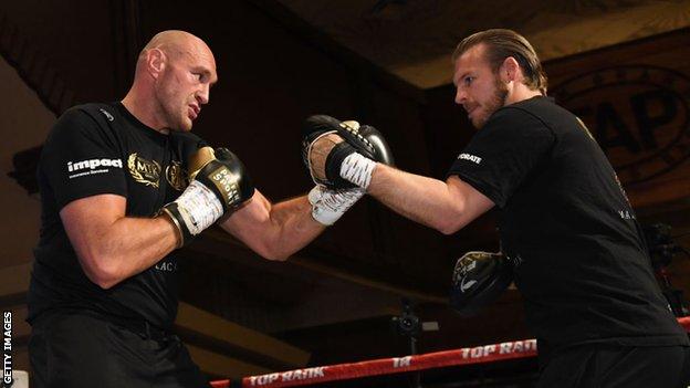 Tyson Fury (left) spars with his trainer Ben Davison