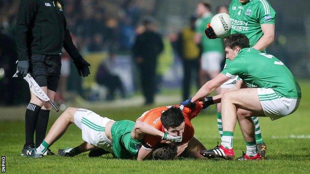 A couple of players indulge in a spot of wresting at the Athletic Grounds