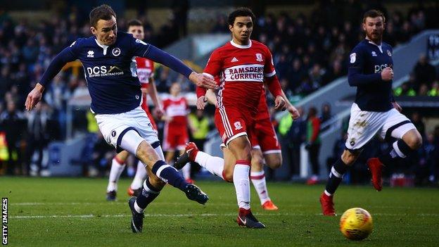 Millwall midfielder Jed Wallace scores the opening goal against Middlesbrough at the Den