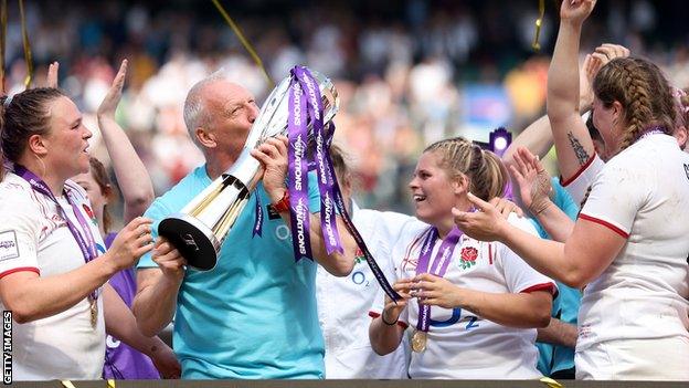 Head coach Simon Middleton lifts the trophy