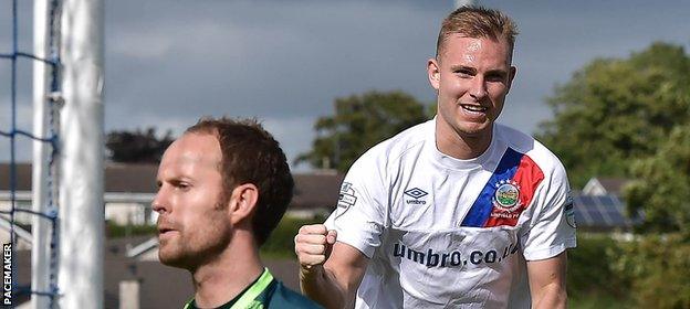 Andy Mitchell's penalty wrapped up Linfield's 4-0 win at Dungannon