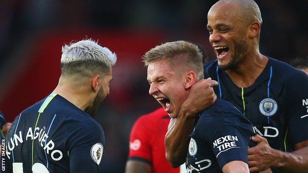 Oleksandr Zinchenko, Sergio Aguero and Vincent Kompany celebrate Manchester City's third goal against Southampton