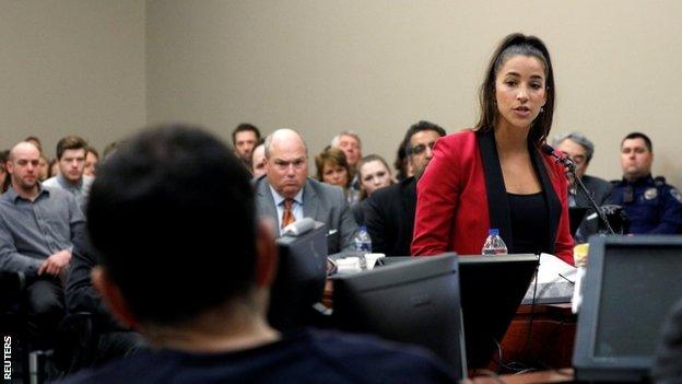 Three-time Olympic gold medallist Aly Raisman addresses the court