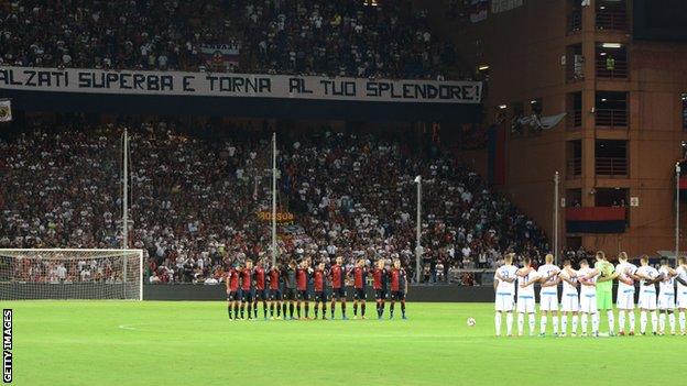 Players pictured during a minute's silence before Sunday's Genoa v Empoli match