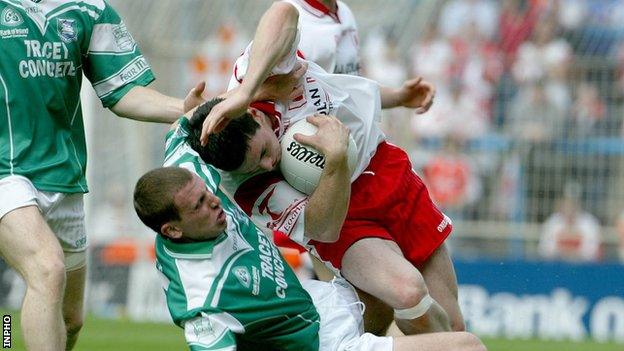 Kieran Donnelly challenges Tyrone's Conor Gormley during the 2003 All-Ireland Football quarter-final