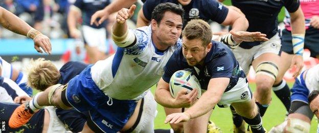 Greig Laidlaw dives to score a Scotland try