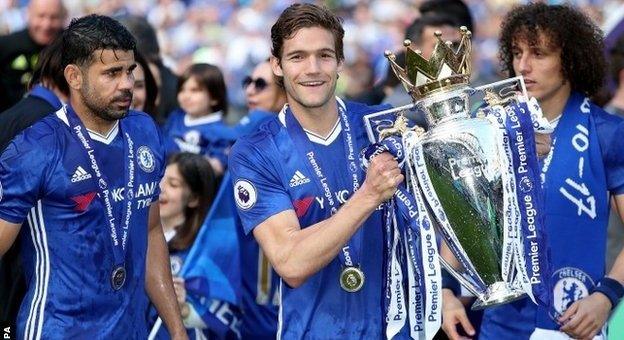 Chelsea players with the Premier League trophy