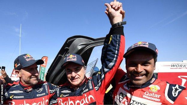 Carlos Sainz celebrates winning the 2020 Dakar Rally