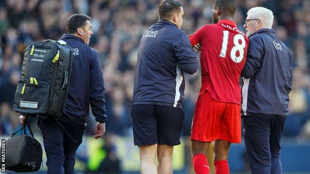 Leicester's Molla Wague is helped from the pitch after getting injured against Millwall