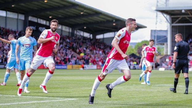 Paul Mullin celebrates after scoring Wrexham's first goalk from the penalty spot