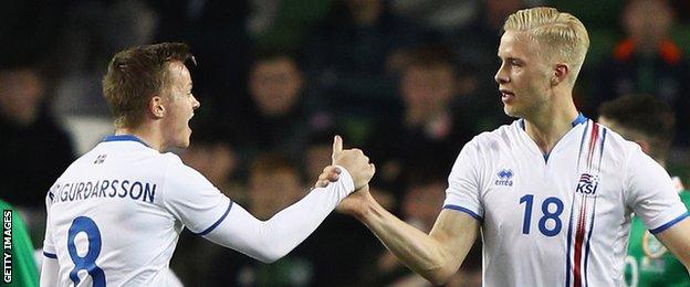 Aron Sigurdarson (left) congratulated Iceland goalscorer Hordur Magnusson