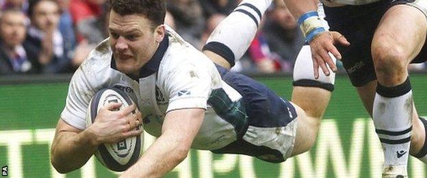 Duncan Taylor dives over to score Scotland's second try