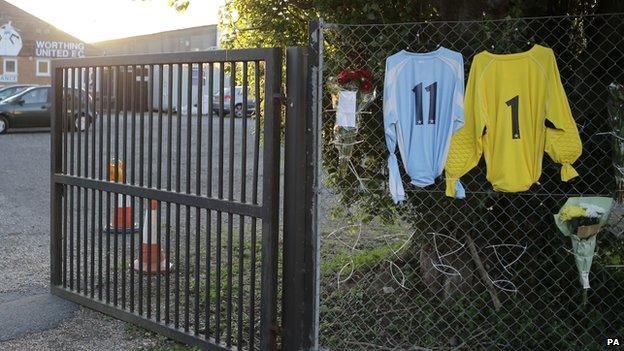 Two shirts and floral tributes outside Worthing United Football Club to Shoreham Airshow crash victims Matthew Grimstone and Jacob Schilt